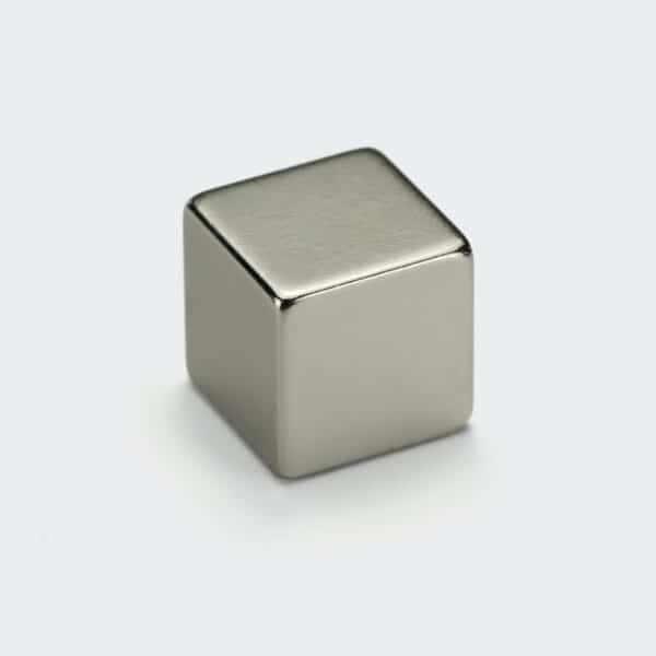 Cube shaped rare earth magnet with smooth nickel plated surface with rounded corners.