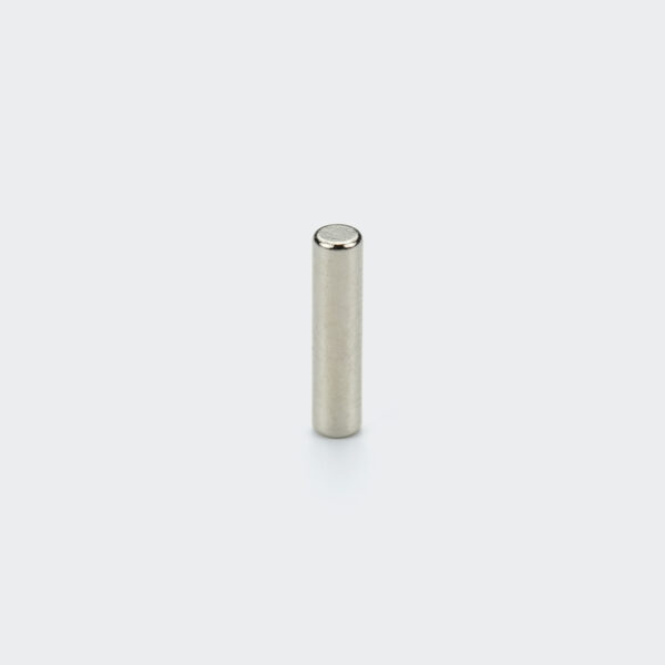 A small diameter 3mm nickel plated NdFeB cylinder magnet vertically placed on a white background with its flat end